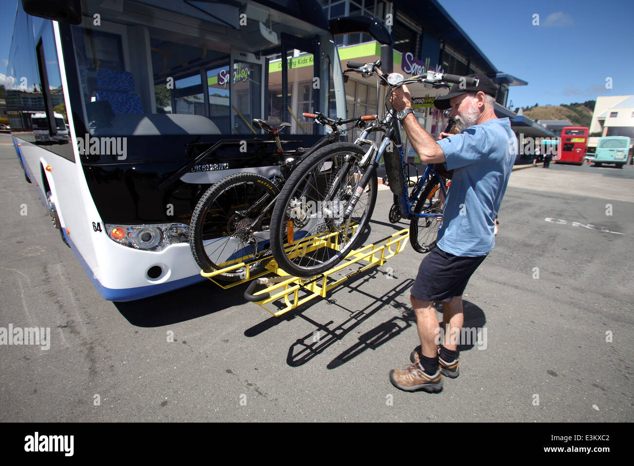 A Cyclist Places His Bike On The Rack Of A Bus In Nelson New Zealand Stock Photo Alamy