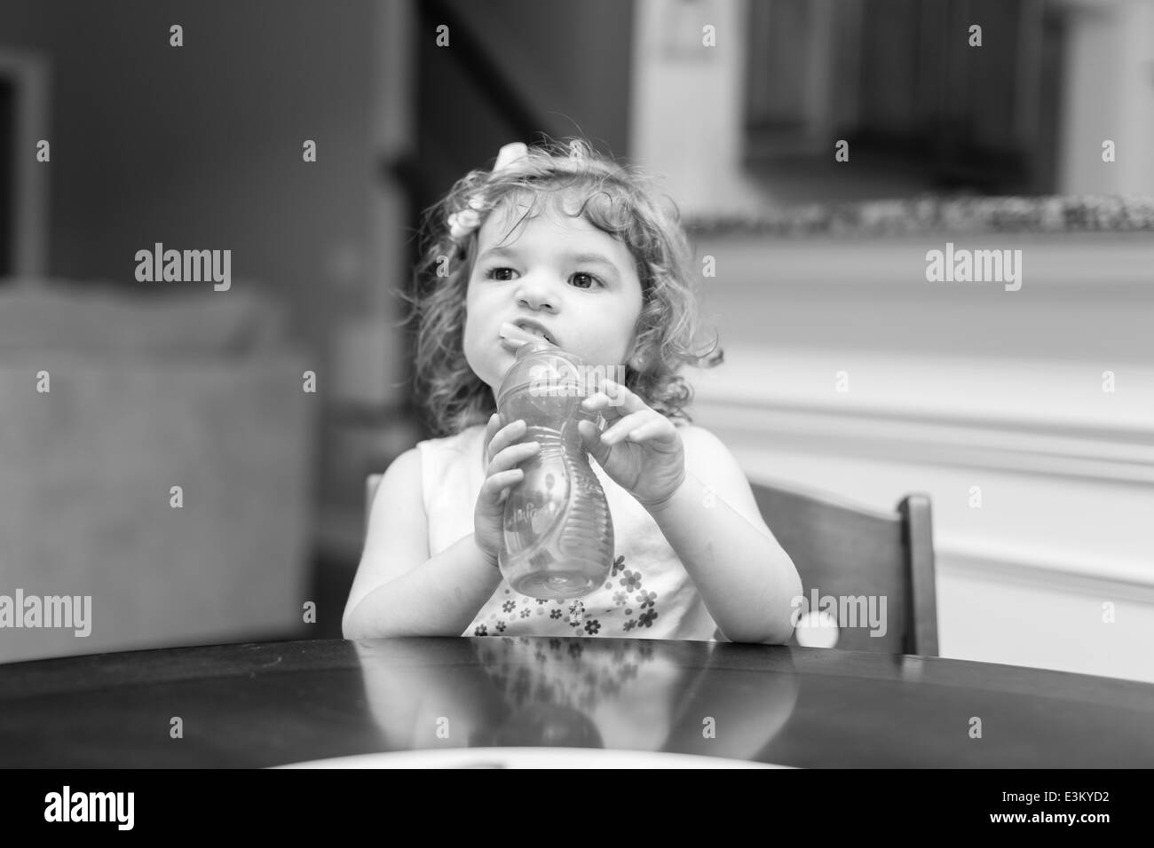 Little girl at dinner time making facial expressions Stock Photo - Alamy