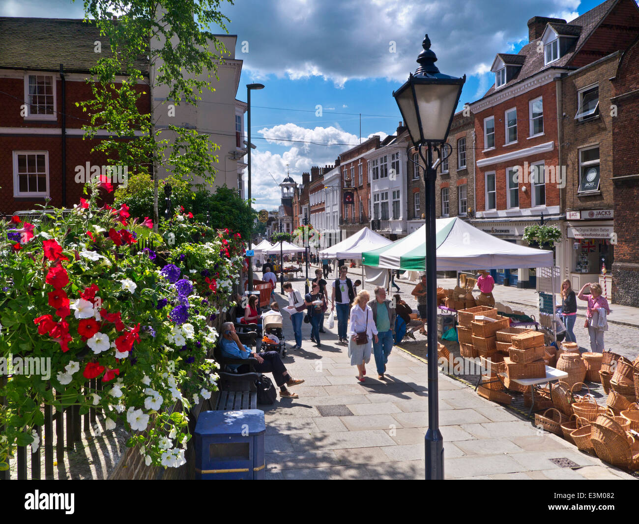 MARKET GUILDFORD Historic Guildford High Street and shoppers on a floral summer arts and crafts market day Guildford Surrey UK Stock Photo