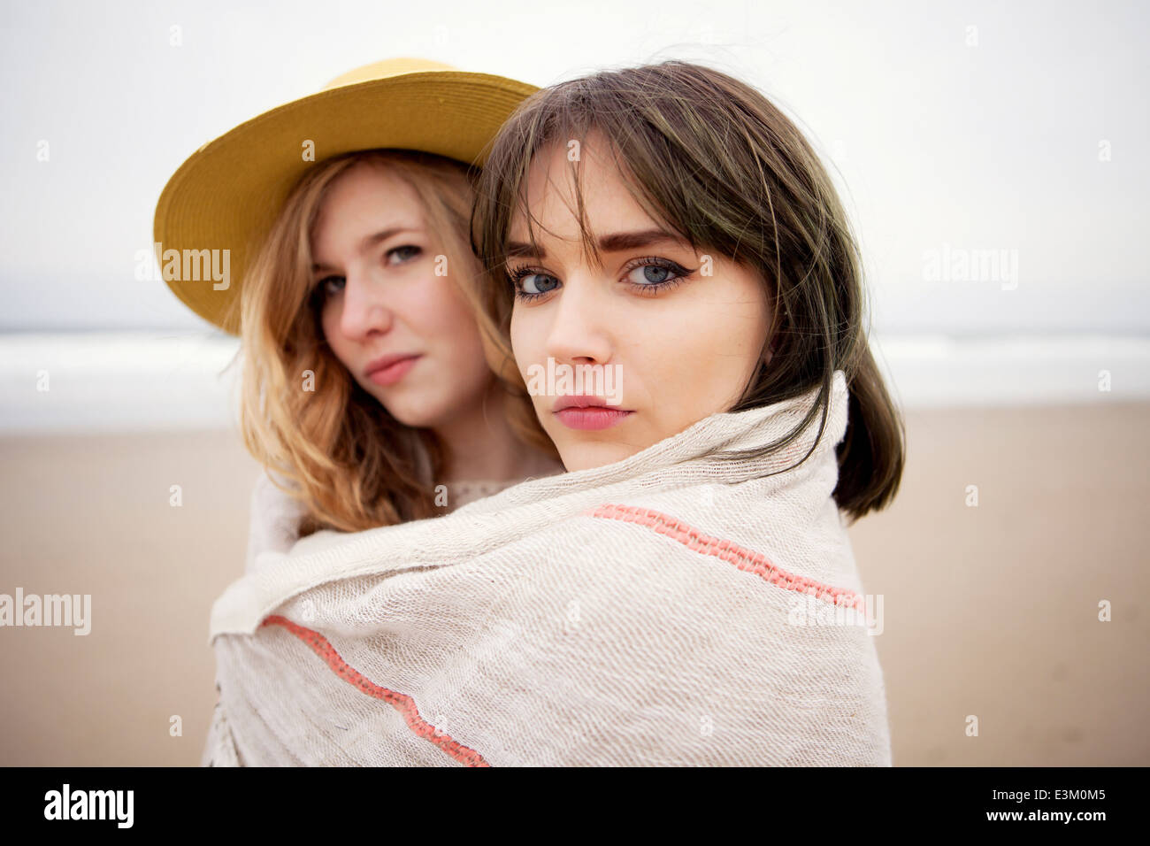 Portrait of teenage girl (13-15) and her friend wrapped in towel, New Hampshire, USA Stock Photo