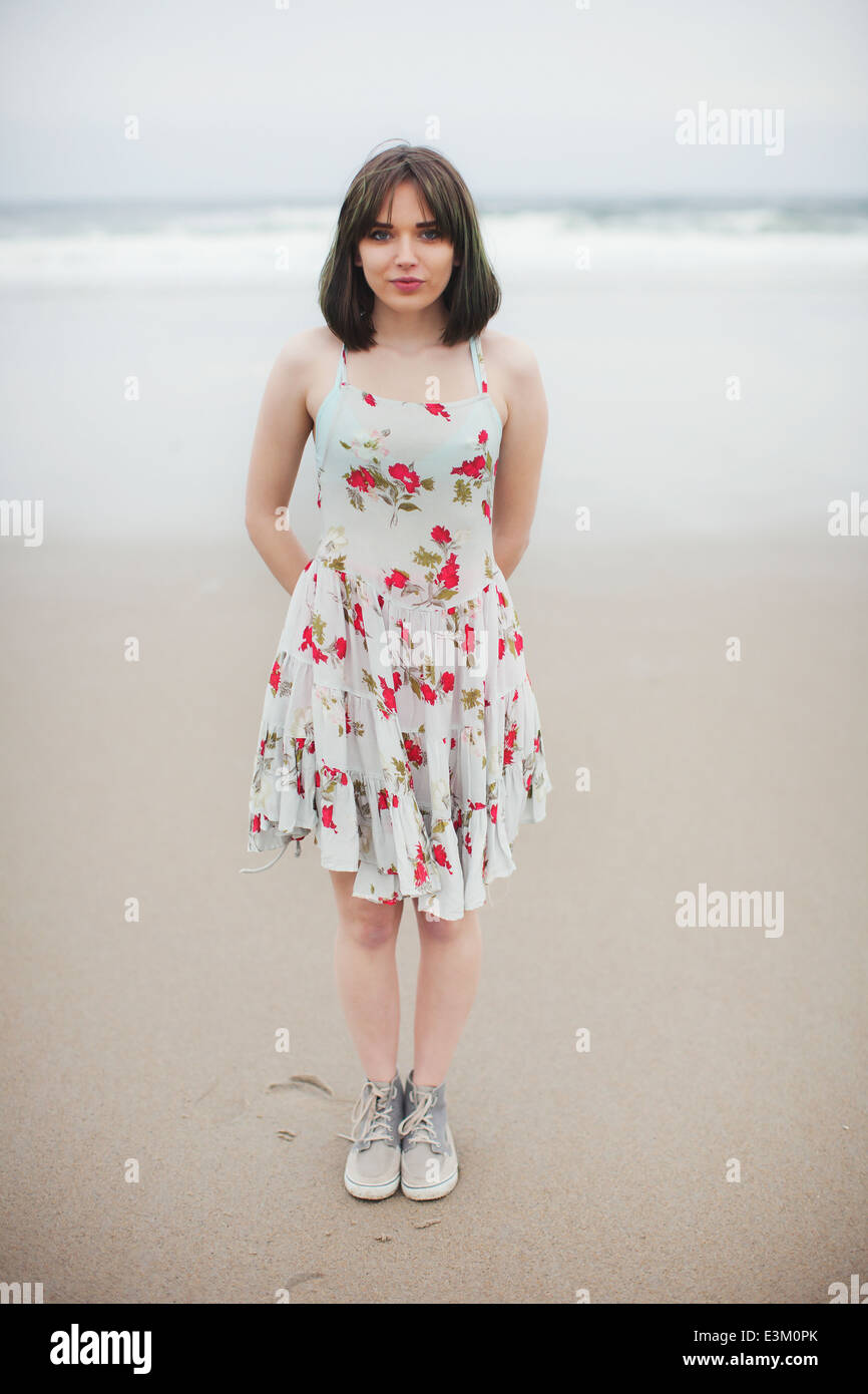 Portrait of young woman standing on beach, New Hampshire, USA Stock Photo