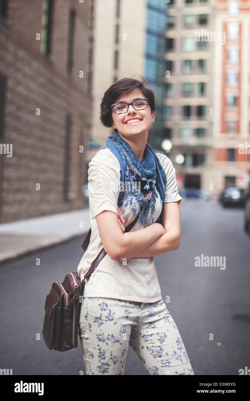 Portrait of young woman with arms crossed Stock Photo - Alamy