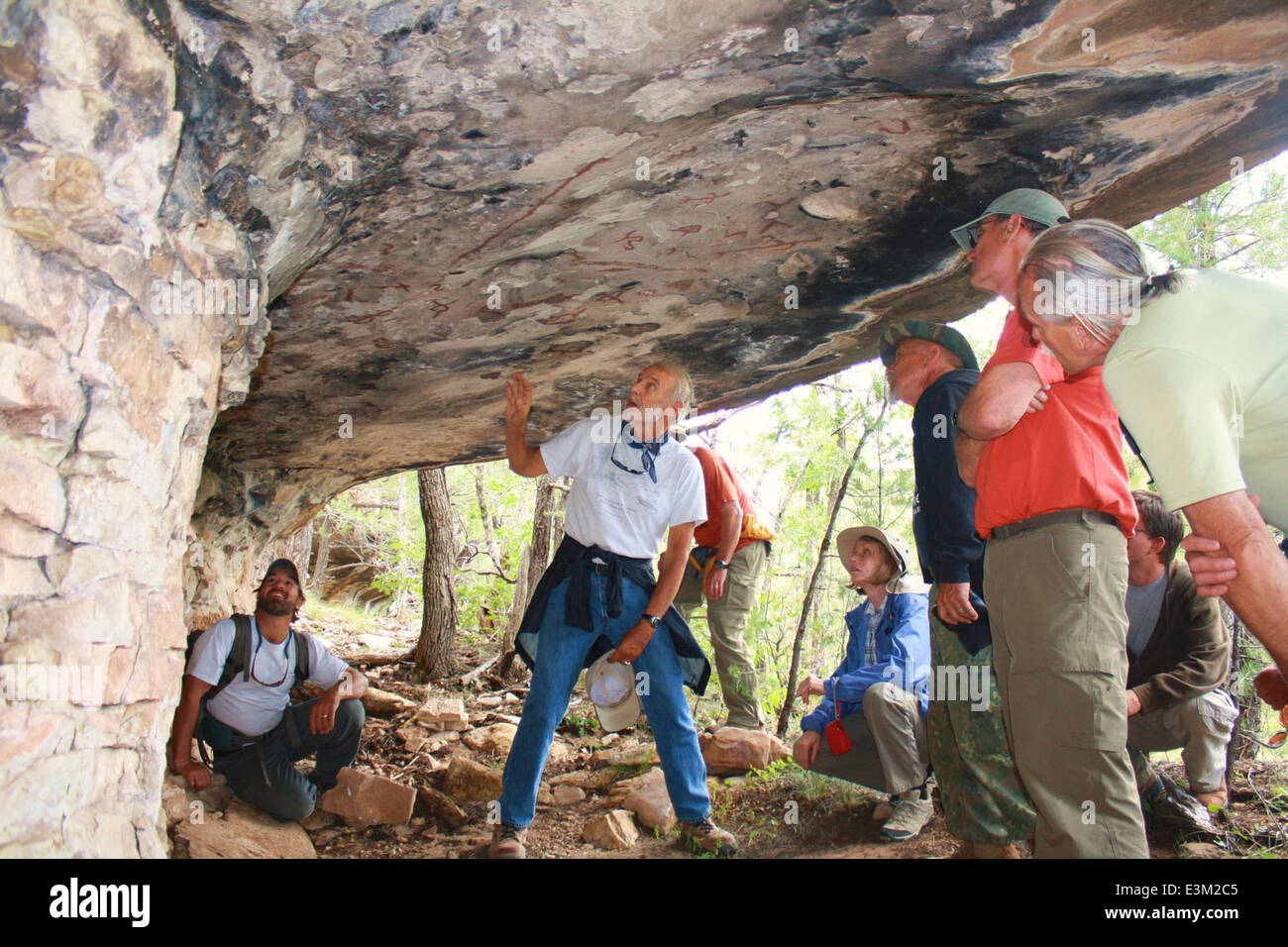 Examing Rocks Together Examining Rock Art Stock Photo - Alamy