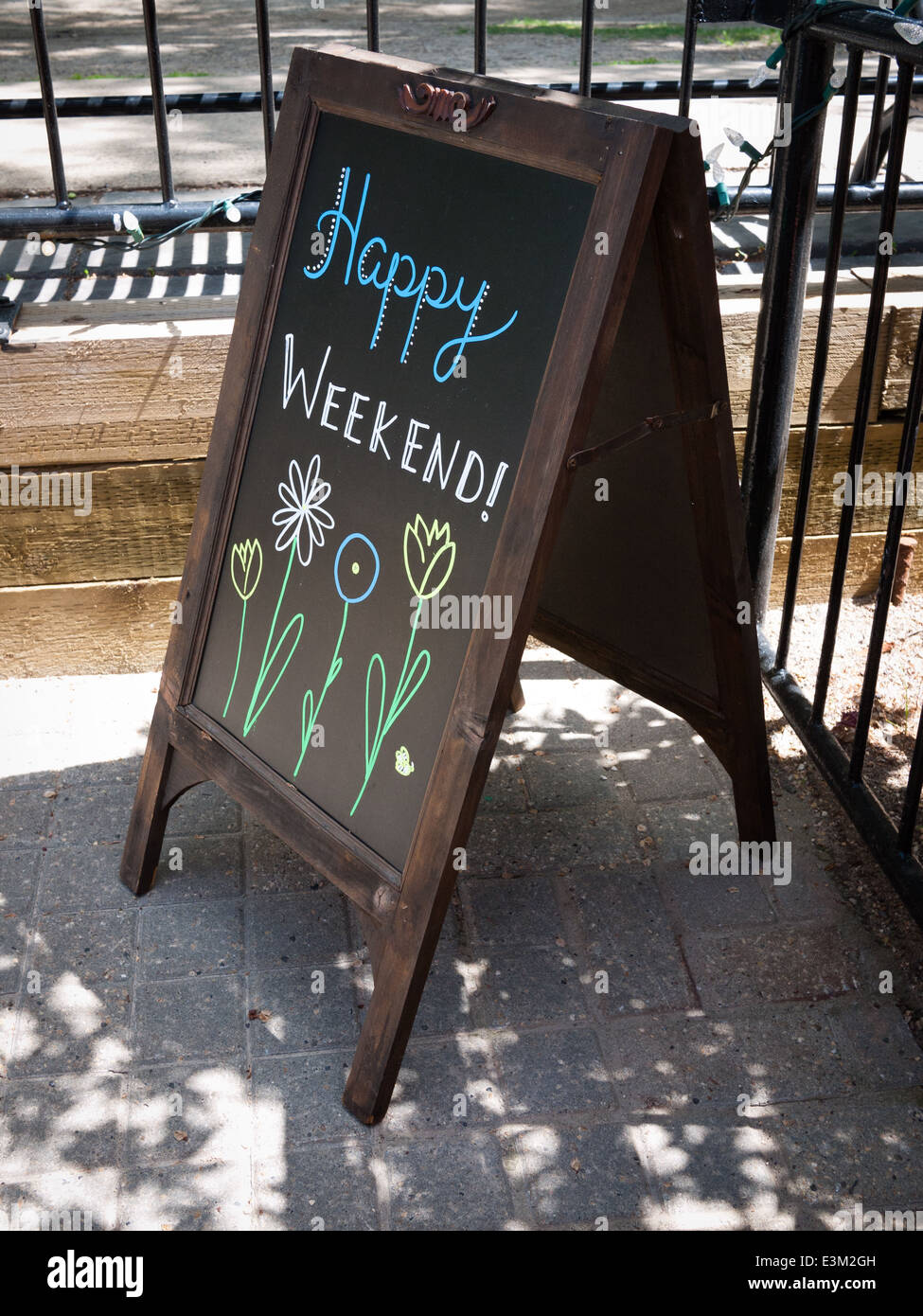 An outdoor sign which says: Happy Weekend! Stock Photo