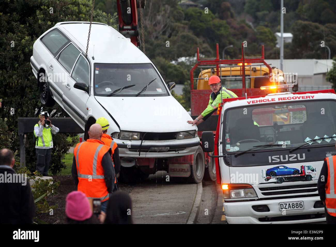 Vehicle being recovered from a creek after a fatal road accident
