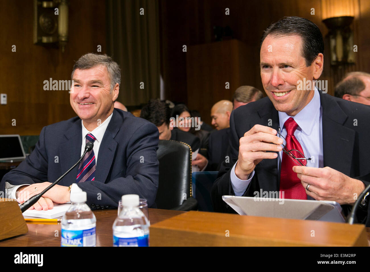 Washington DC, USA. 24th June, 2014. Michael White, chairman and CEO of DIRECTV, left, and Randall Stephenson, president and CEO of AT&T, right, testify before the Senate Antitrust, Competition Policy and Consumer Rights Subcommittee during a hearing on 'The AT&T/DIRECTV Merger: The Impact on Competition and Consumers in the Video Market and Beyond,' in Washington, D.C. on June 24, 2014. Credit:  Kristoffer Tripplaar/Alamy Live News Stock Photo