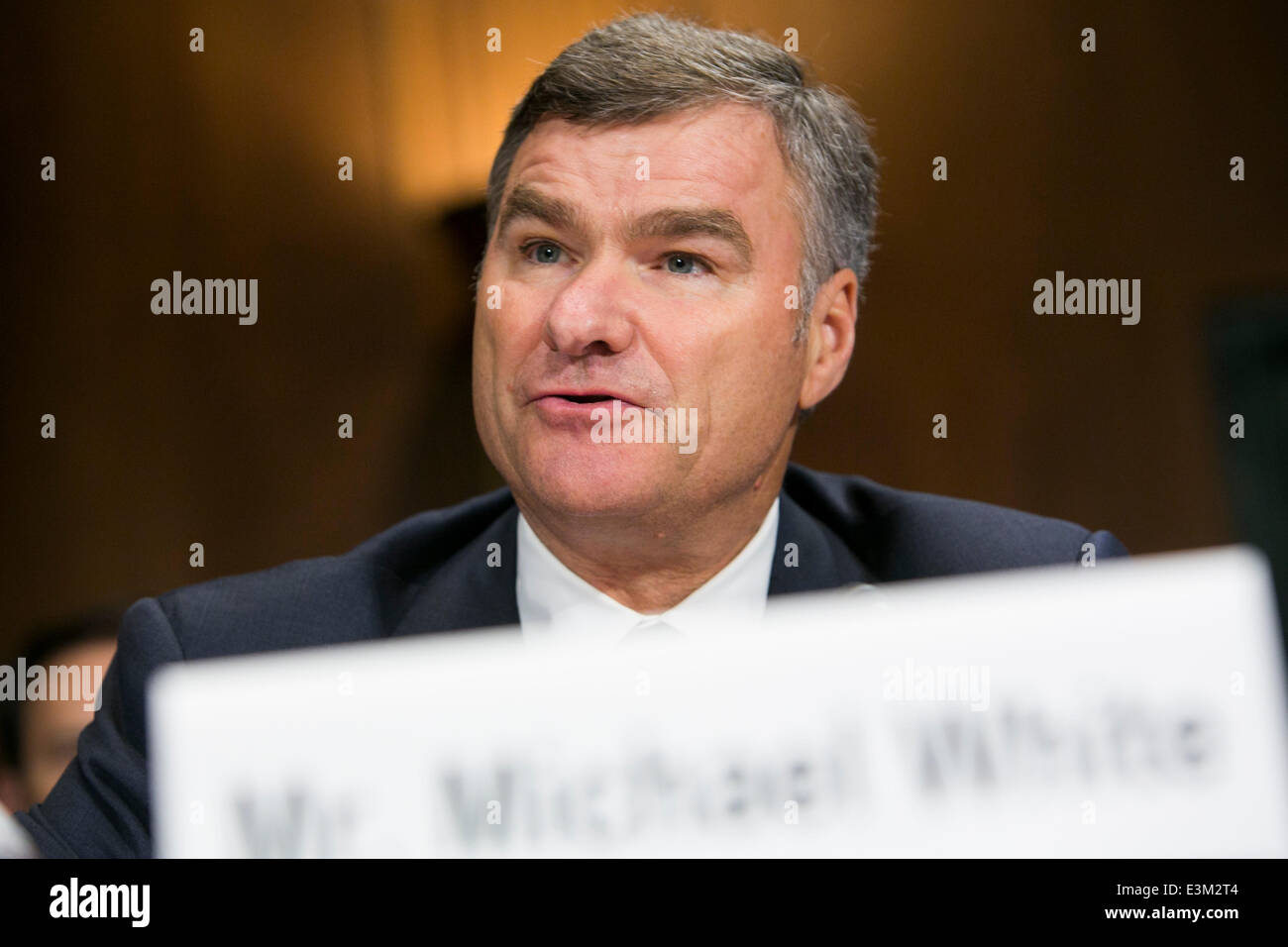 Washington DC, USA. 24th June, 2014. Michael White, chairman and CEO of DIRECTV, testifies before the Senate Antitrust, Competition Policy and Consumer Rights Subcommittee during a hearing on 'The AT&T/DIRECTV Merger: The Impact on Competition and Consumers in the Video Market and Beyond,' in Washington, D.C. on June 24, 2014. Credit:  Kristoffer Tripplaar/Alamy Live News Stock Photo