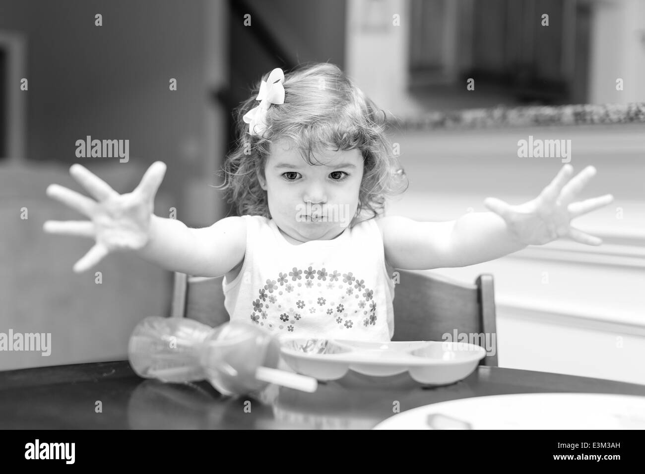 Little girl at dinner time making facial expressions Stock Photo - Alamy