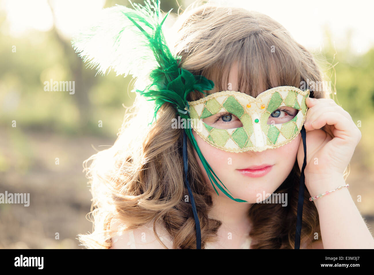 Picture of teenage girl (13-15) with mask Stock Photo