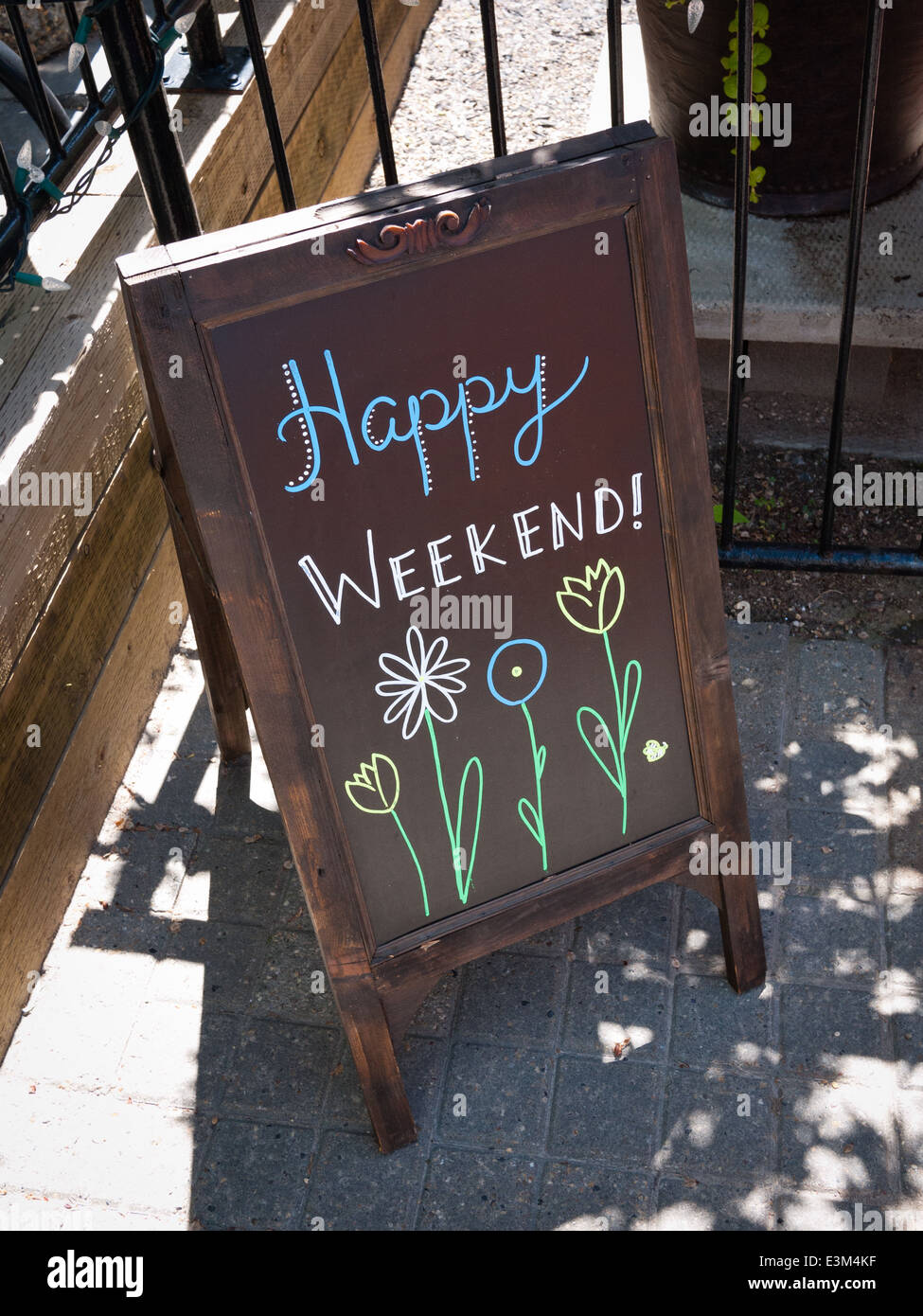 An outdoor sign which says: Happy Weekend! Stock Photo