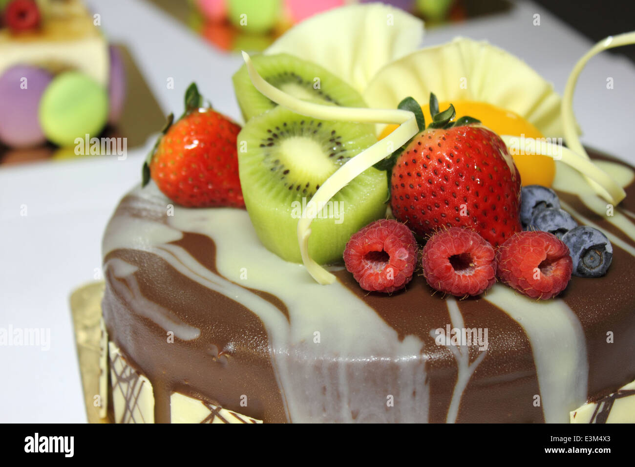 A Chocolate cake and topped with fresh fruit Stock Photo - Alamy