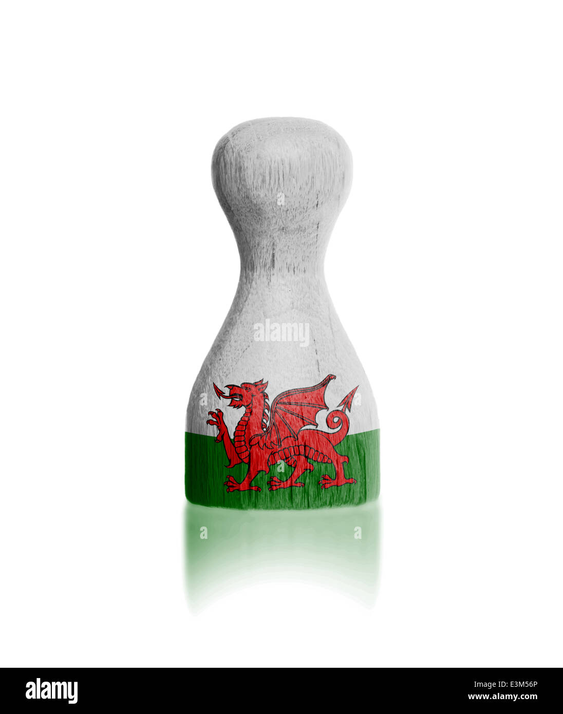 Wooden pawn with a painting of a flag, Wales Stock Photo