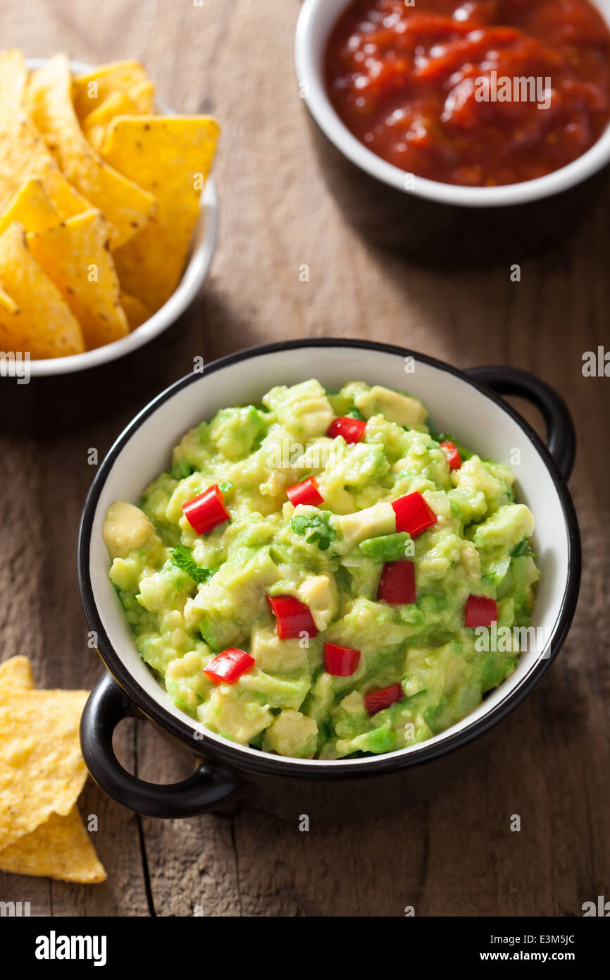 guacamole with avocado, lime, chili and tortilla chips Stock Photo Alamy