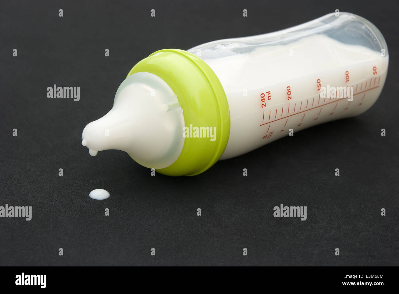 baby bottle with milk on black background Stock Photo