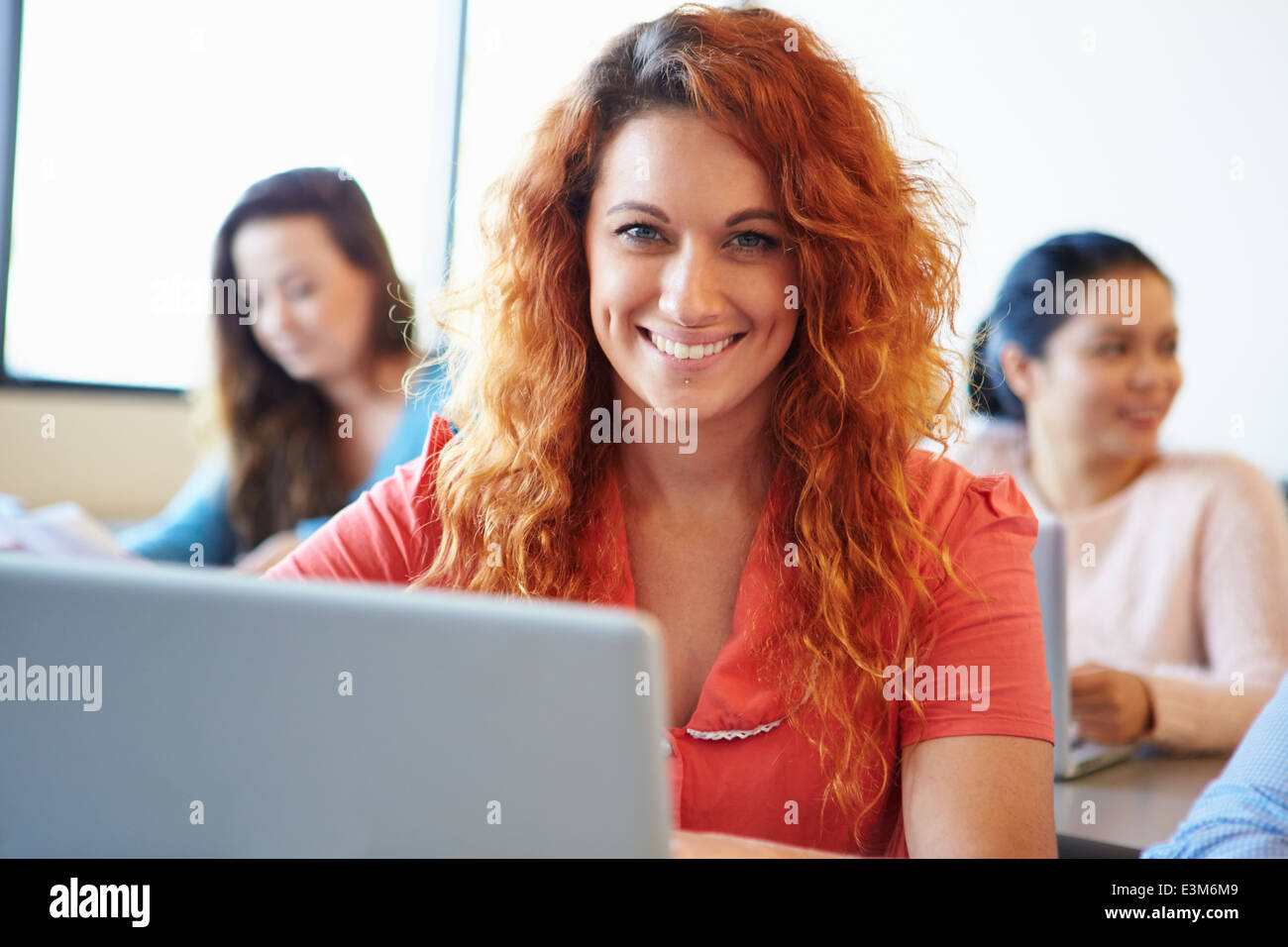Female University Student Using Laptop In Classroom Stock Photo - Alamy