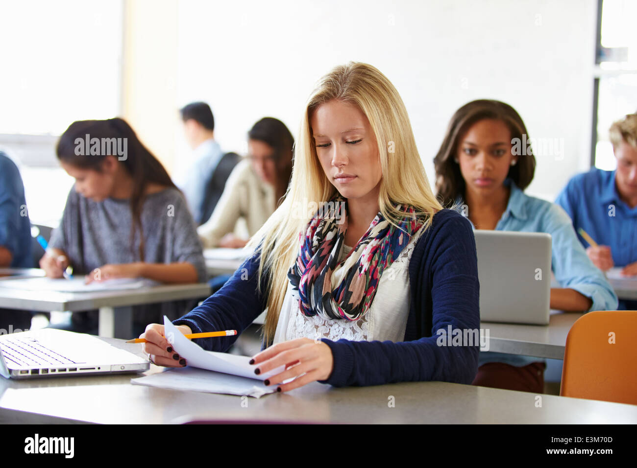 Female High School Student Studying At Desk Stock Photo