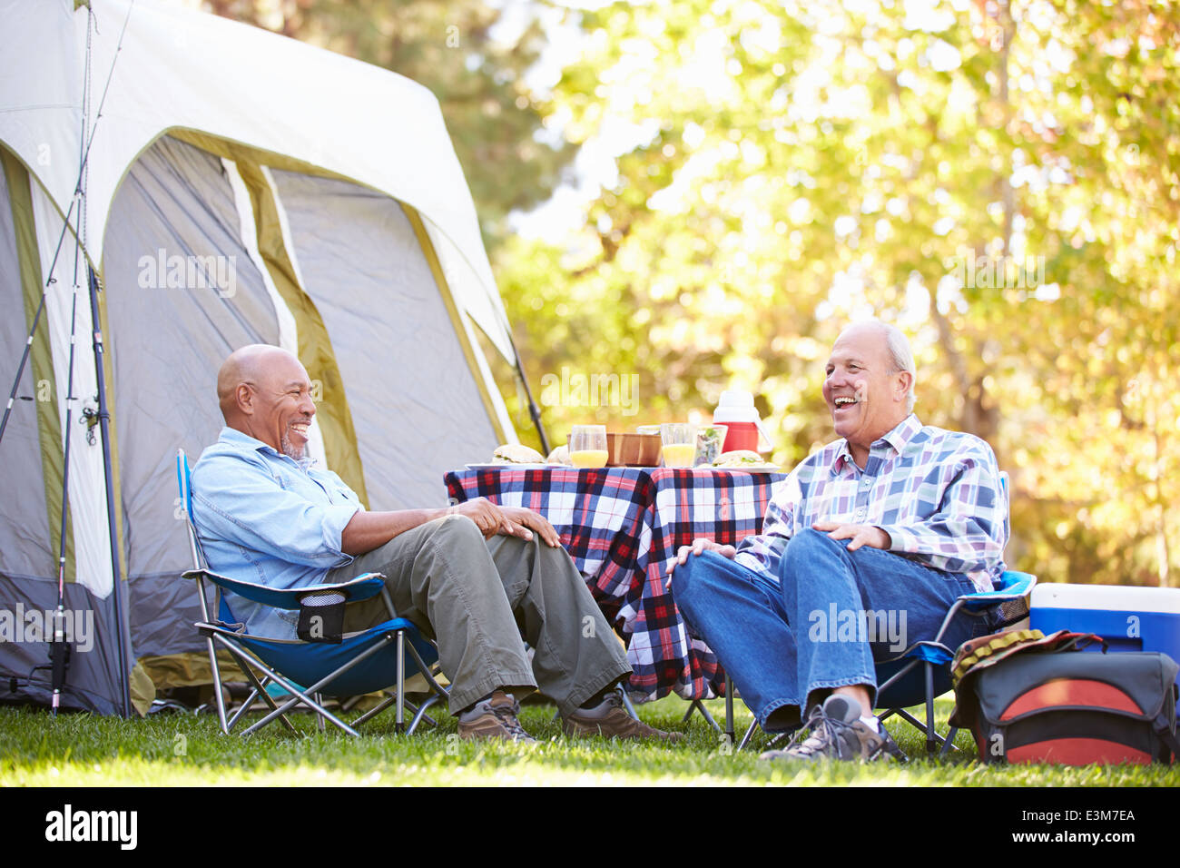 Two Senior Men Relaxing On Camping Holiday Stock Photo