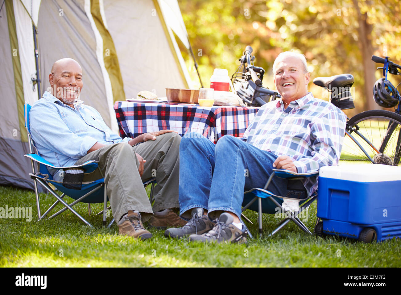 Two Senior Men Relaxing On Camping Holiday Stock Photo