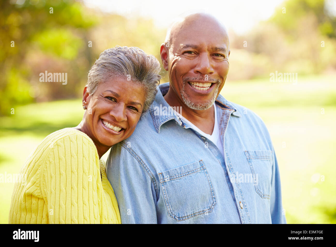 Senior Couple Walking Through Autumn Woodland Stock Photo - Alamy