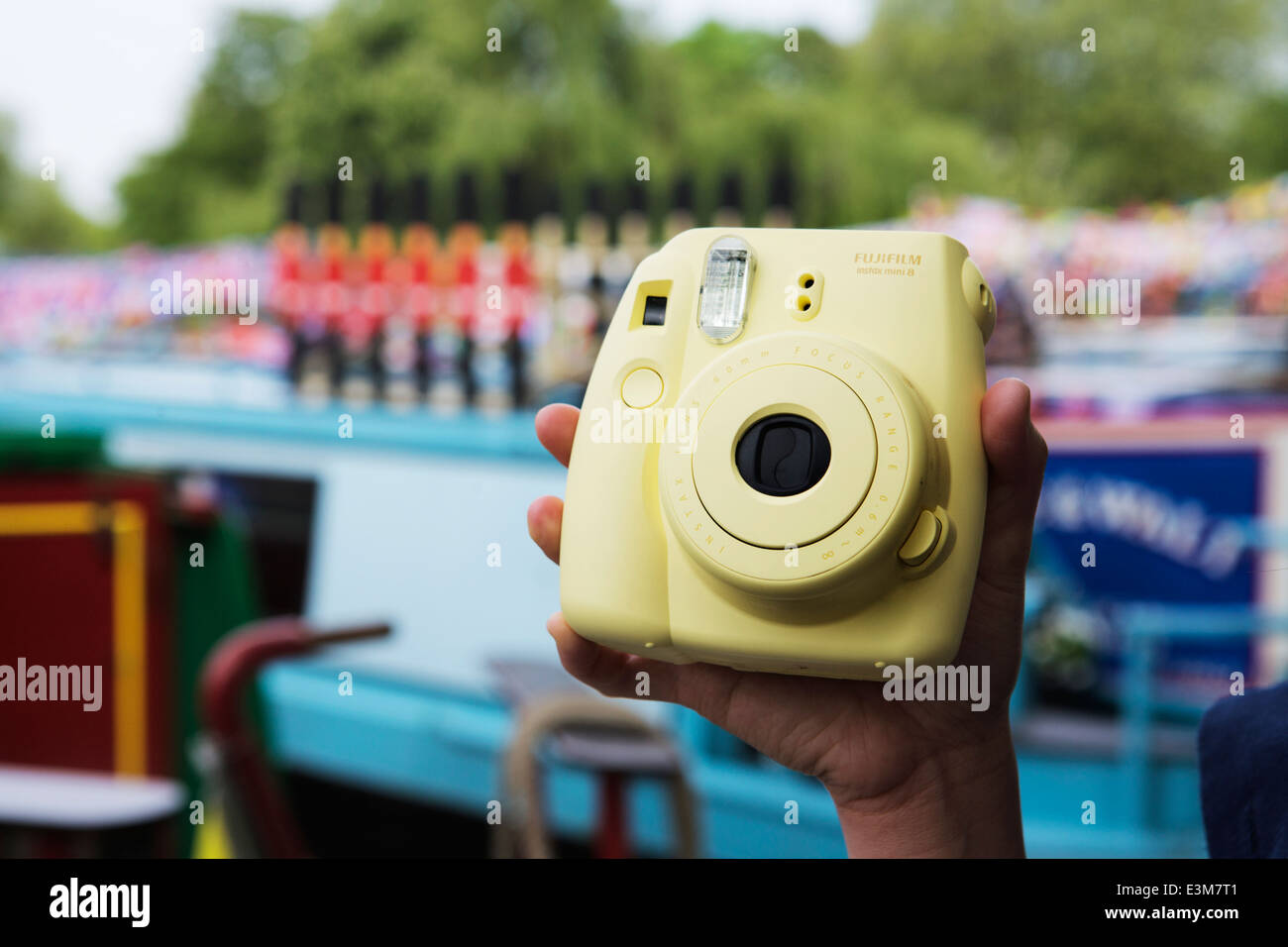 Instant Polaroid camera: Fujifilm Instax mini 8 camera yellow. Stock Photo