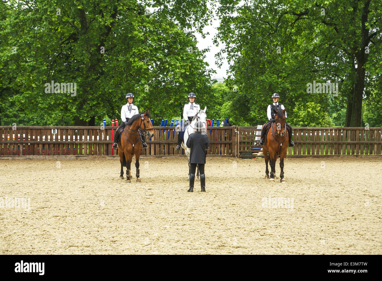 Female police offerers  on horses learning to ride, central London, UK Stock Photo