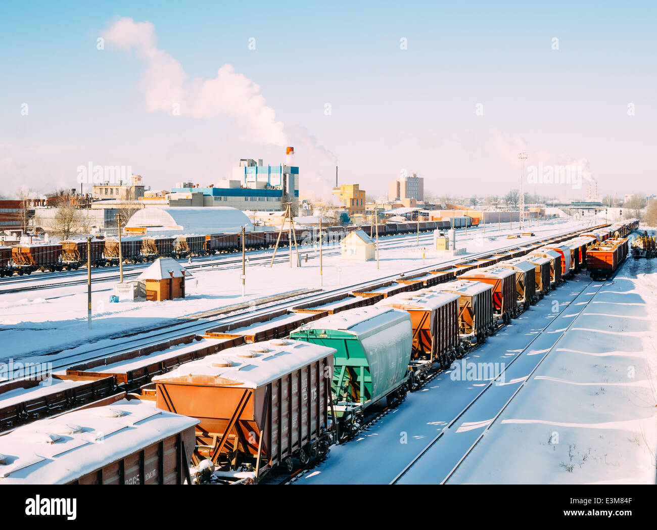Commodity freight wagons and train on rails in Belarussian railway station. The top view. Winter 2013-2014, snow, frost Stock Photo