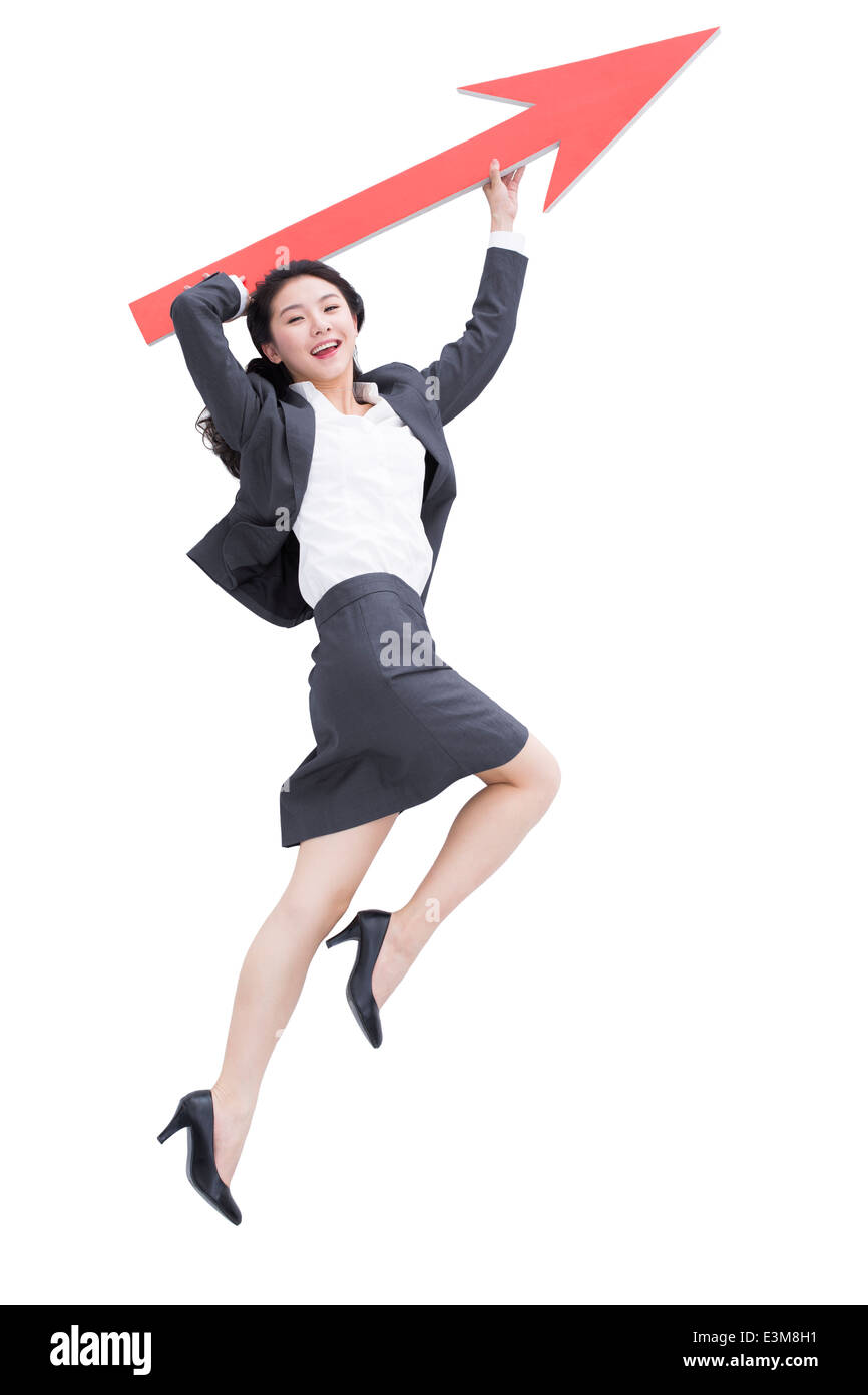 Businesswoman with red arrow sign Stock Photo - Alamy