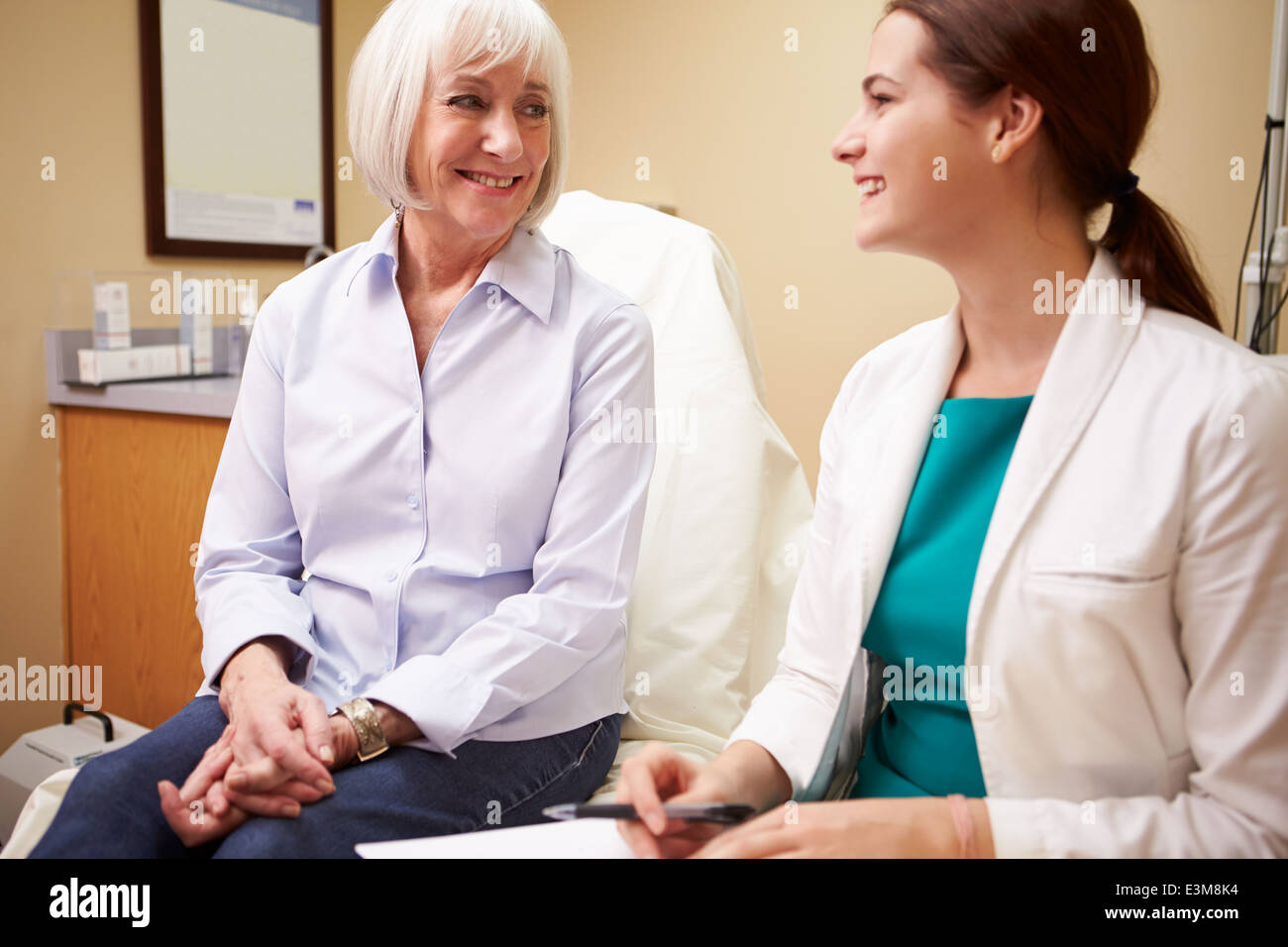 Doctor In Consultation With Senior Female Patient Stock Photo