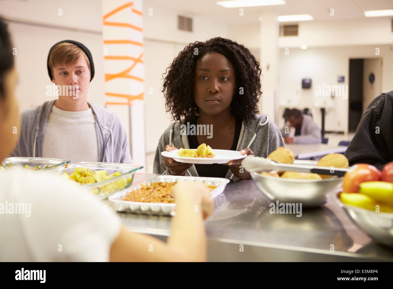 Kitchen Serving Food In Homeless Shelter Stock Photo