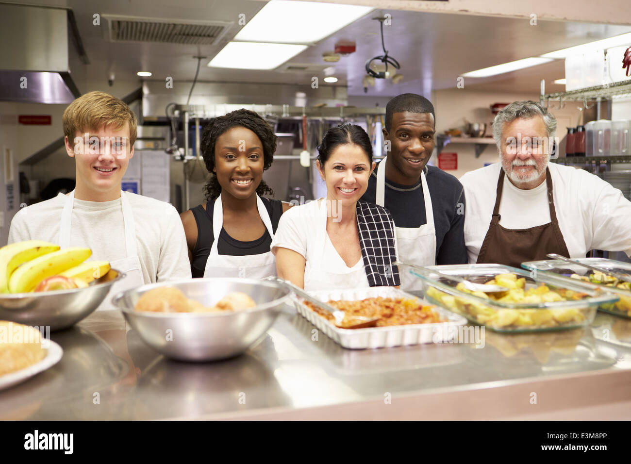 Portrait Of Kitchen Staff In Homeless Shelter Stock Photo