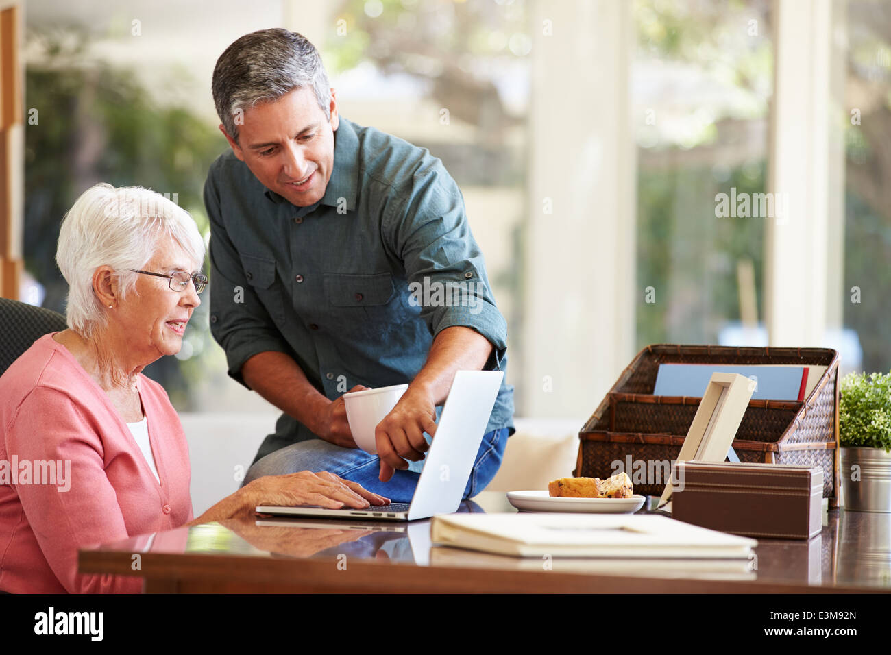 Senior man helping son hi-res stock photography and images - Alamy