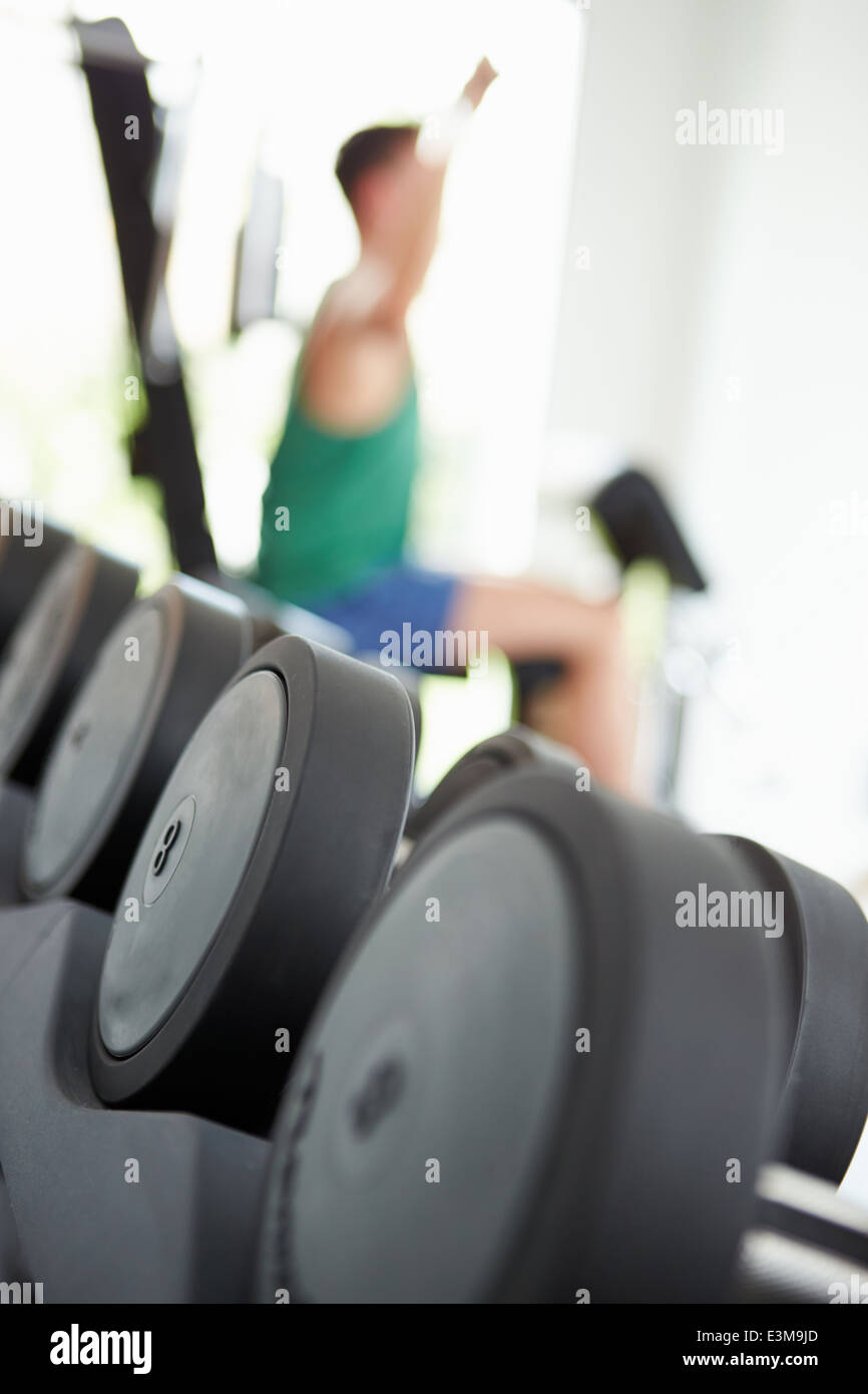 Abstract View Of Man Training With Weights In Gym Stock Photo