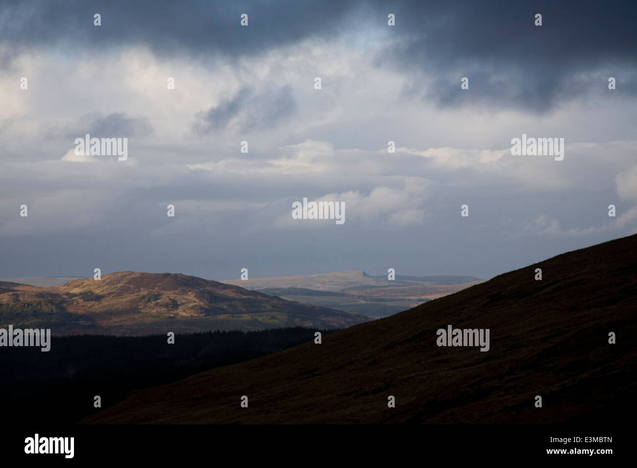 Stormy clouds over the hills of the Galloway Forest Park from the Rhinns of Kells, Dumfries and Galloway, Scotland Stock Photo
