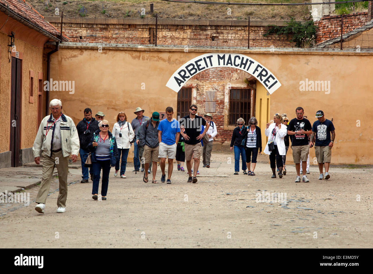 Terezin Concentration Camp, People, Tourists visit Small Fortress  Arbeit Macht Frei above the gate Czech Republic Europe Stock Photo