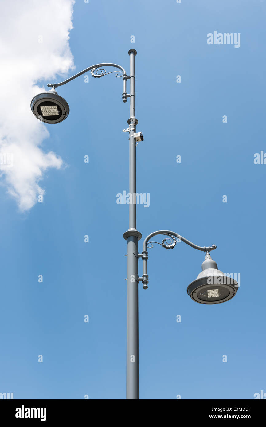 Street Light Pole Against Blue Sky Stock Photo