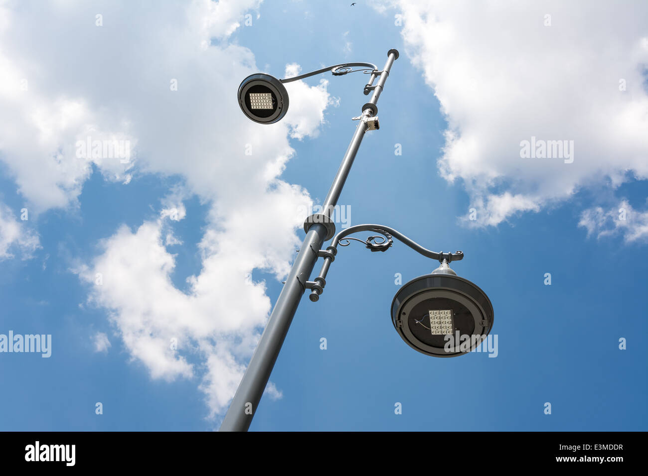 Street Light Pole Against Blue Sky Stock Photo