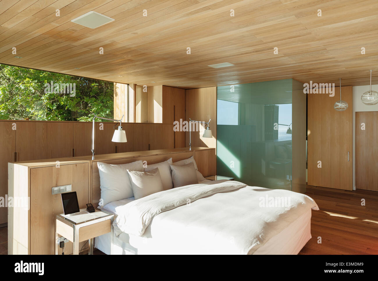Sunny modern bedroom Stock Photo