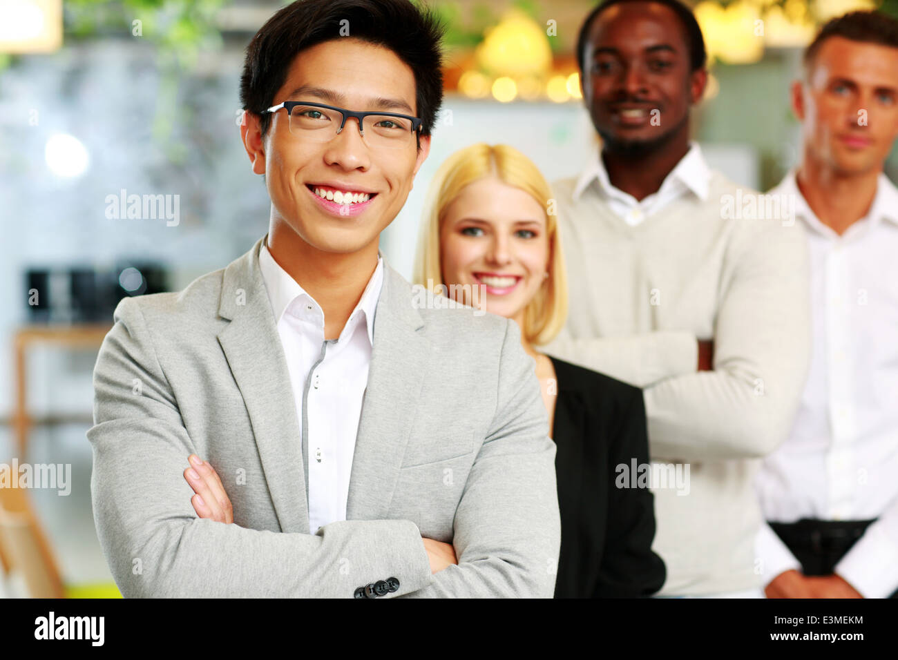 Cheerful group of business people in the office lined up Stock Photo