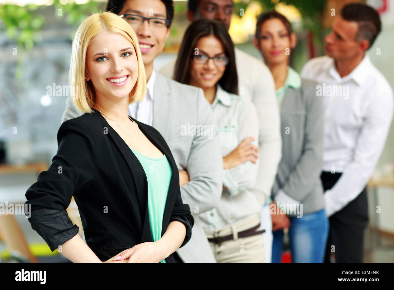 Happy group of business people in the office lined up Stock Photo