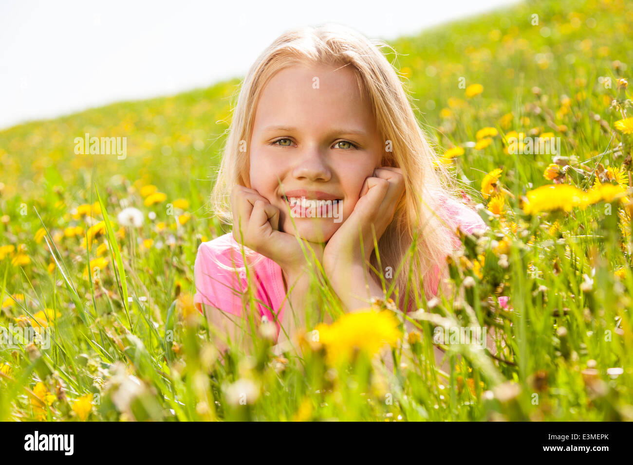 Smiling cute girl holding face with two hands Stock Photo Alamy