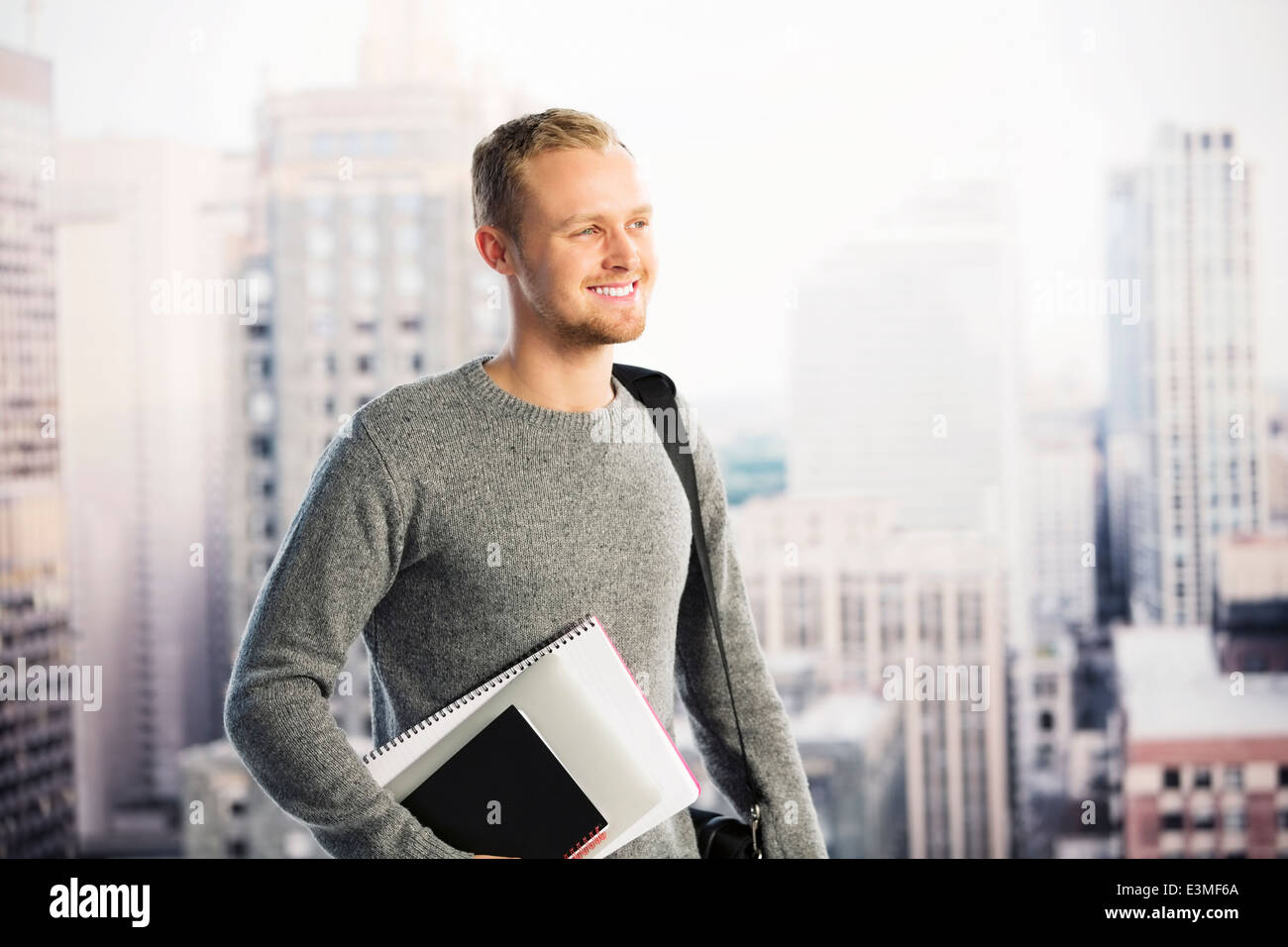 Smiling businessman in urban window Stock Photo