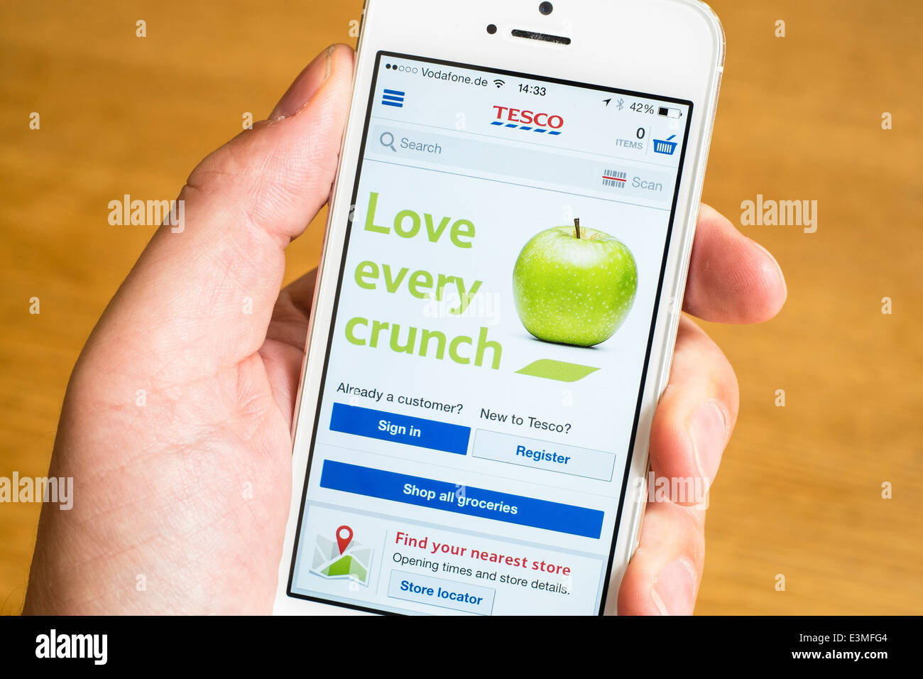 Detail of Tesco supermarket mobile online shop app  on iPhone smart phone Stock Photo