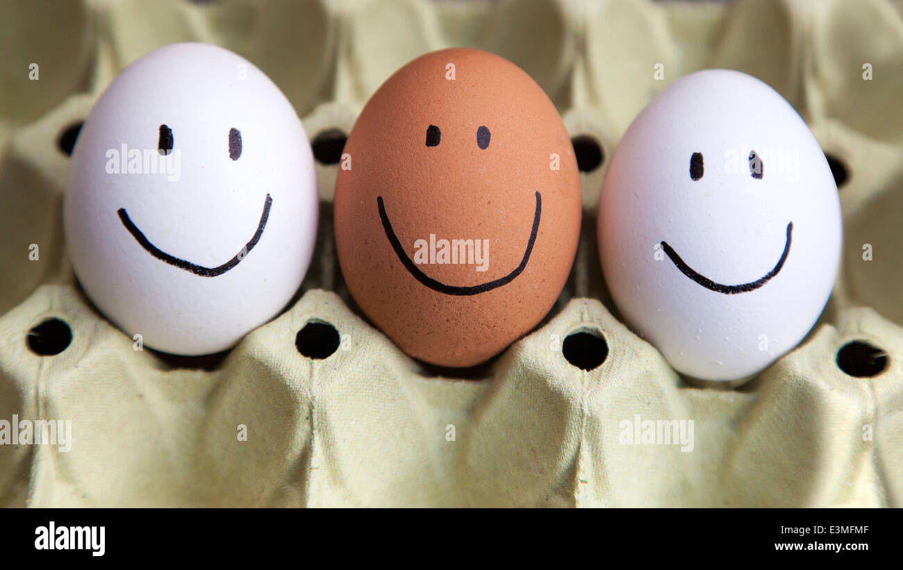 Three eggs with happy faces Stock Photo