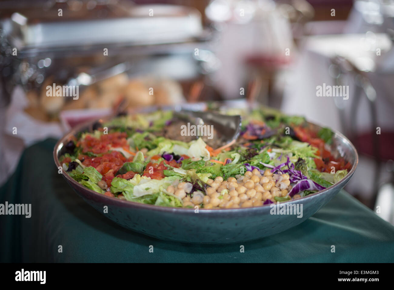 A large salad bowl on a buffet table Stock Photo Alamy