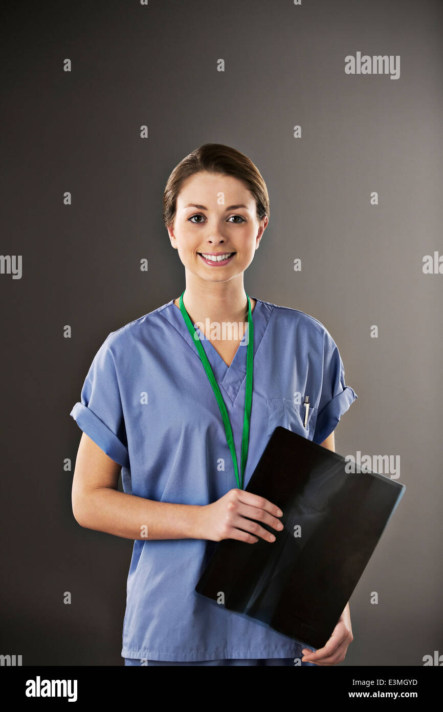 Portrait of confident nurse with x-ray Stock Photo