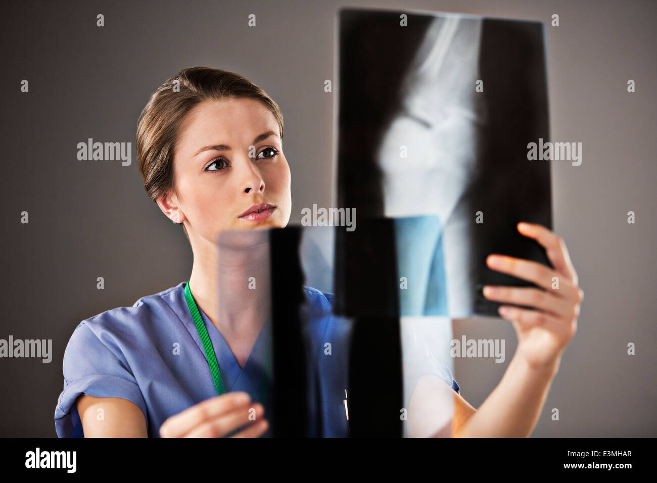 Nurse examining x-rays Stock Photo