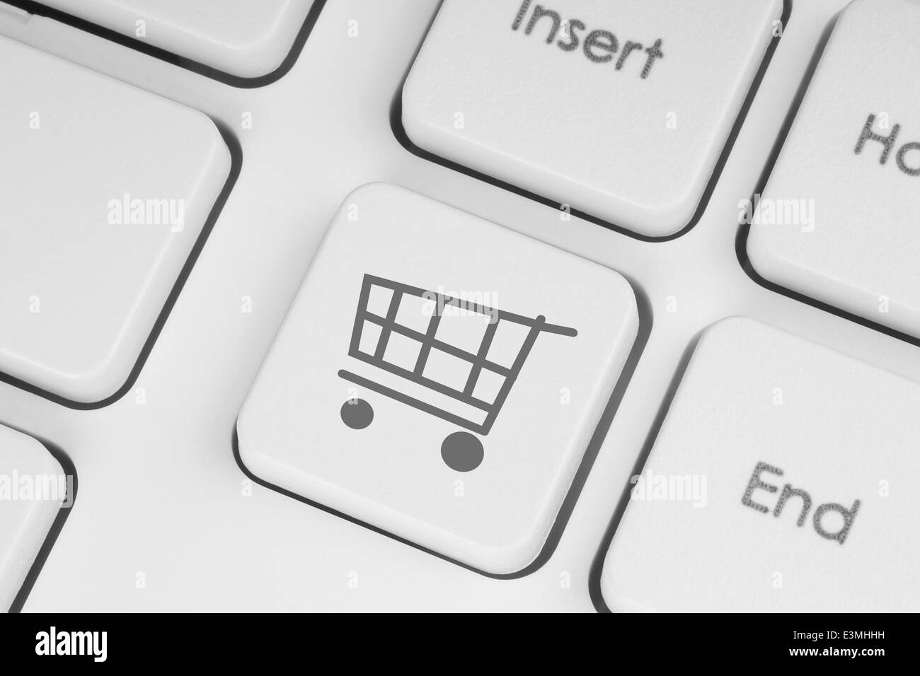 Shopping cart icon on keyboard key closeup Stock Photo Alamy