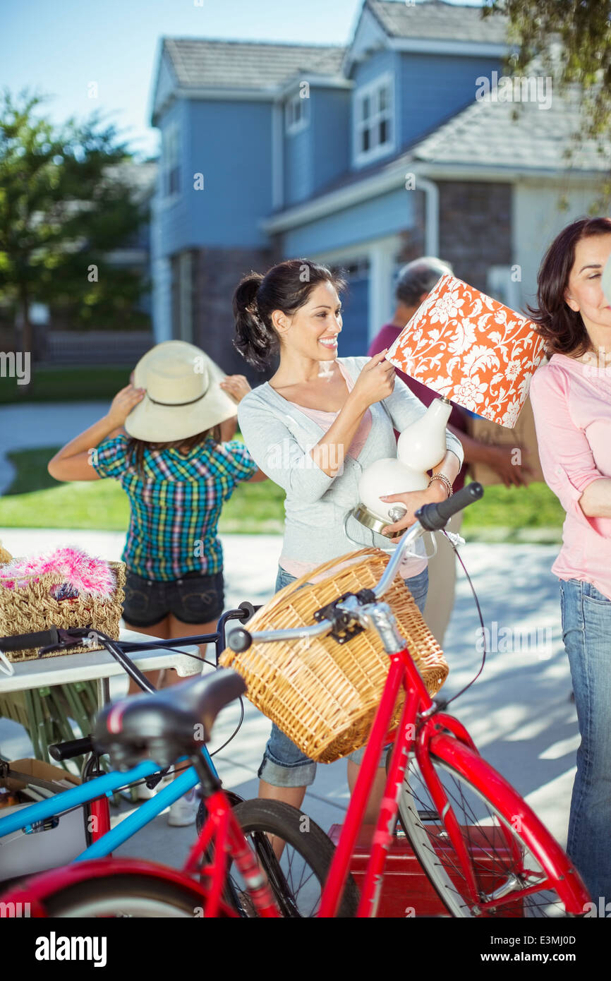 People shopping at yard sale Stock Photo
