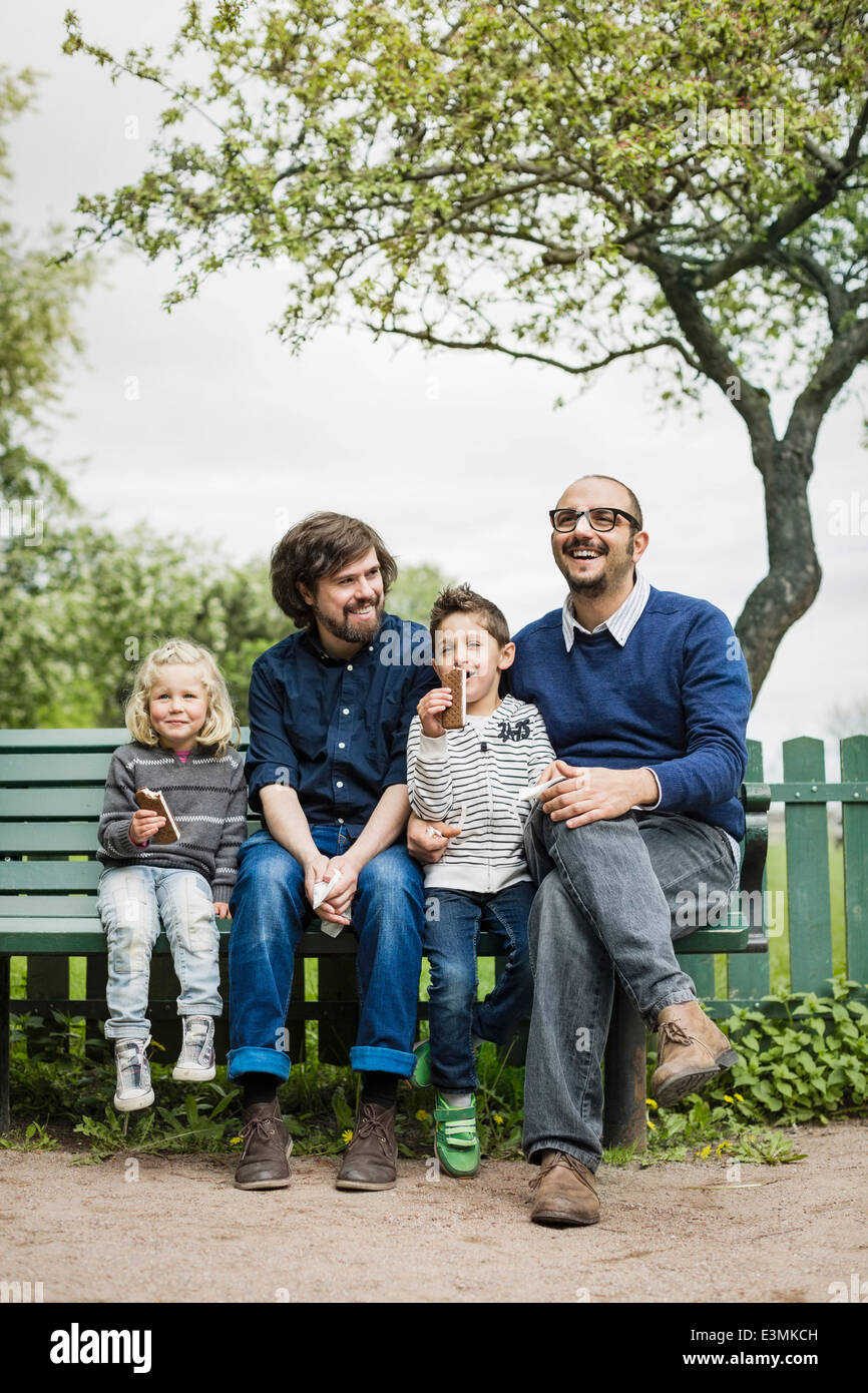 Happy male homosexual family spending leisure time at park Stock Photo