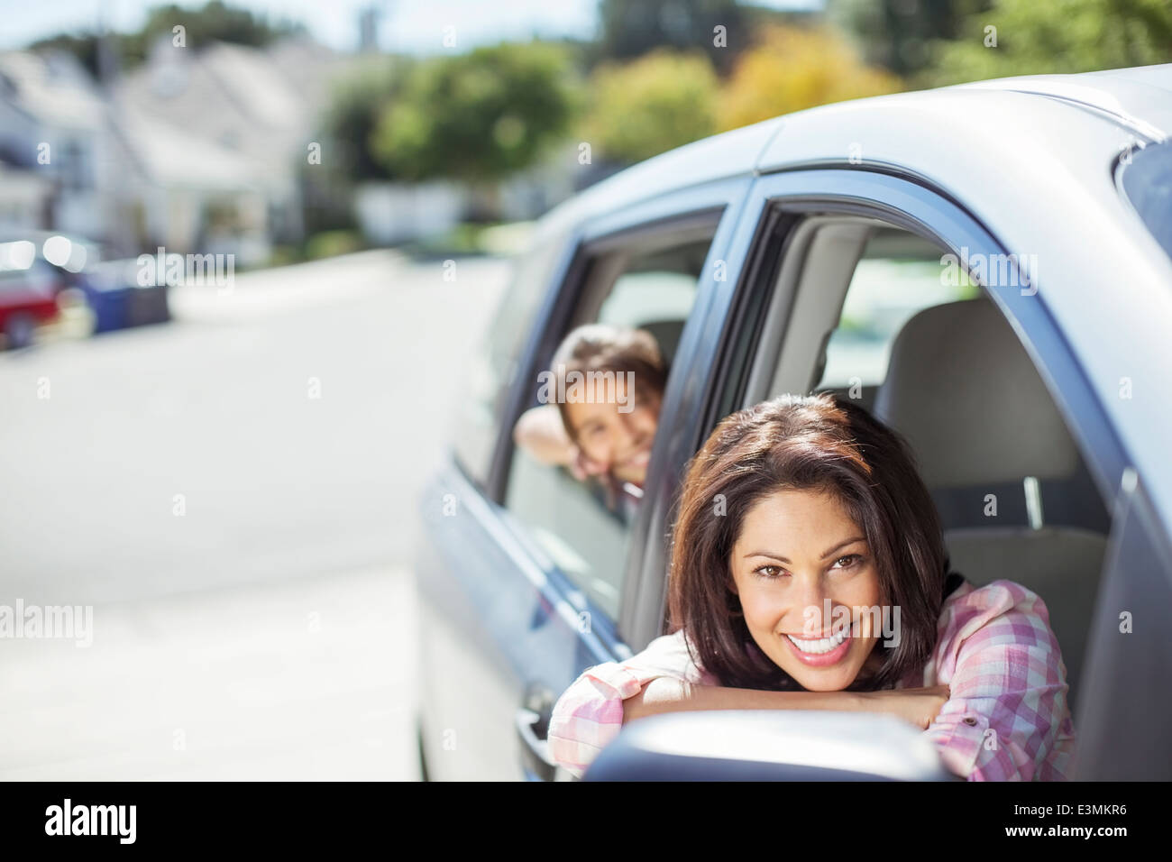 Portrait of smiling mother and daughter in car Stock Photo